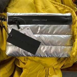 Kendall + Kylie silver puffy wristlet bag